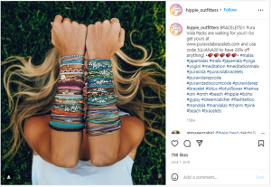 PuraVida Bracelets - by Hippie_Outfitters on IG - Image of a womans arms with lots of different bracelets stacked from wrist to elbow