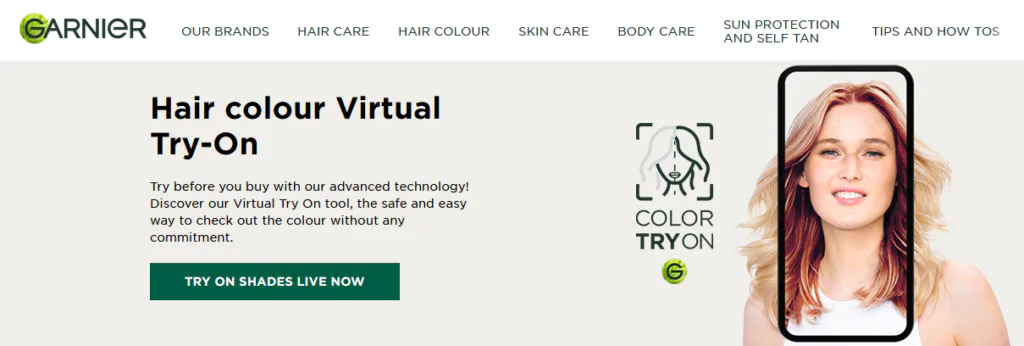 Screenshot of the Garnier Virtual Hair Color Try On page of their website. It shows a phone screen with an image of a woman framed by the phone screen. Within the frame her hair is a darker shade of blonde than the hair visible outside of the frame. 